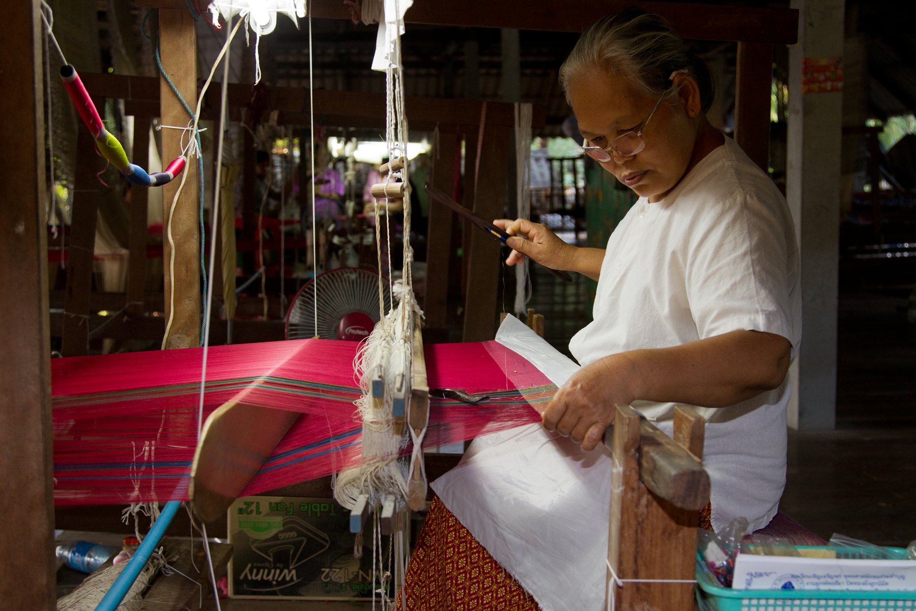 Thai silk weaving on a loom in Surin