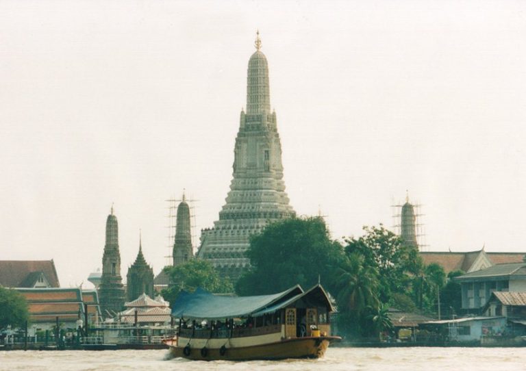 Wat Arun beside the Chao Phraya River in Bangkok
