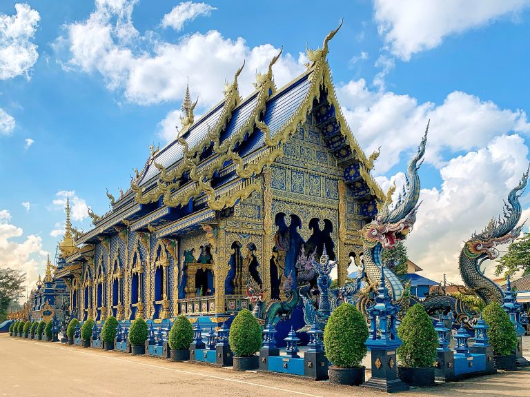 Wat Rong Suea Ten Blue Temple exterior in Chiang Rai
