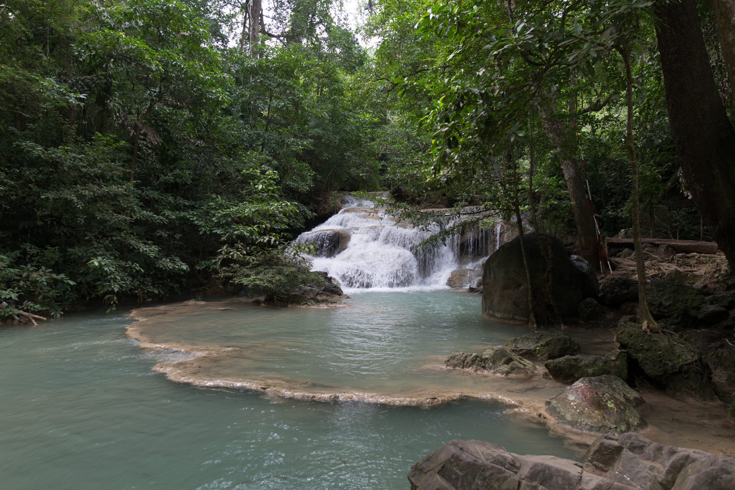 Turquoise waterfall pool at Erawan National Park