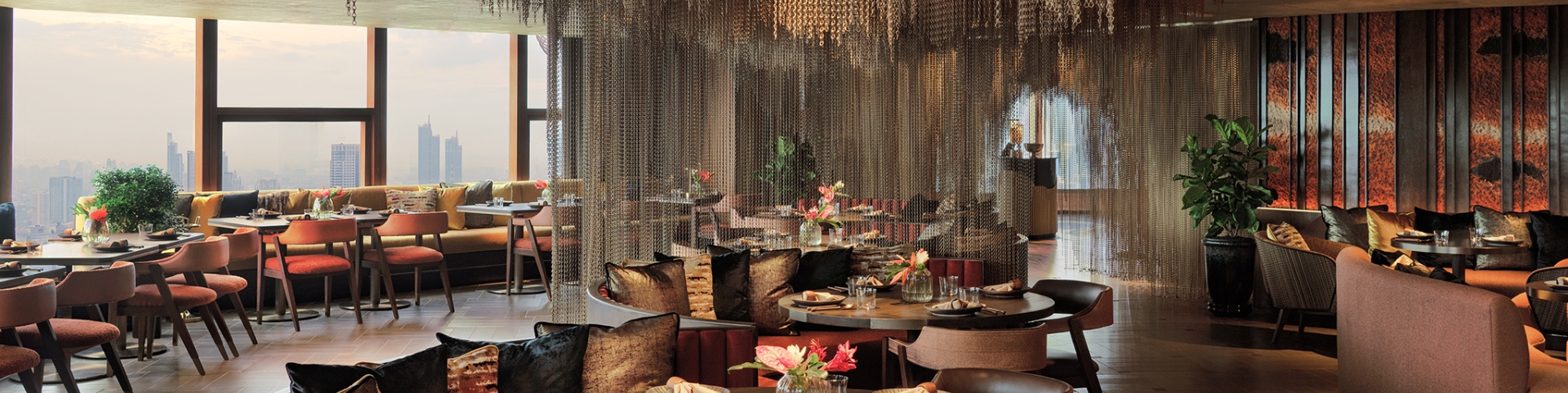 Terrace seating and skyline view at Le Du Kaan