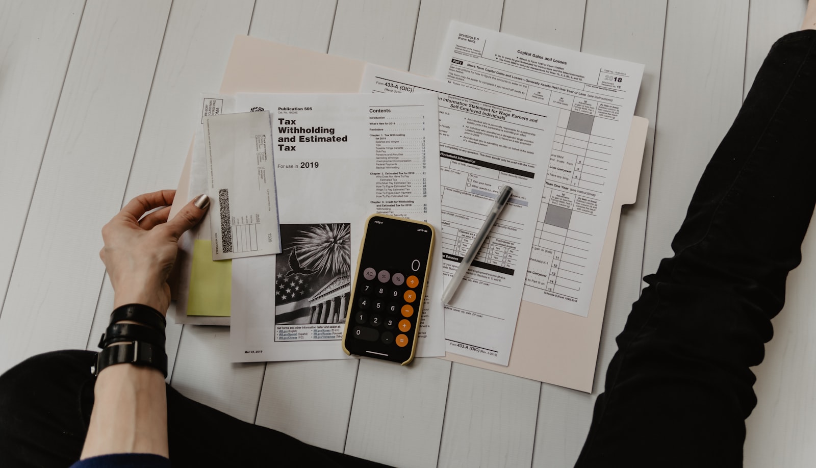 Calculator and paperwork for property costs