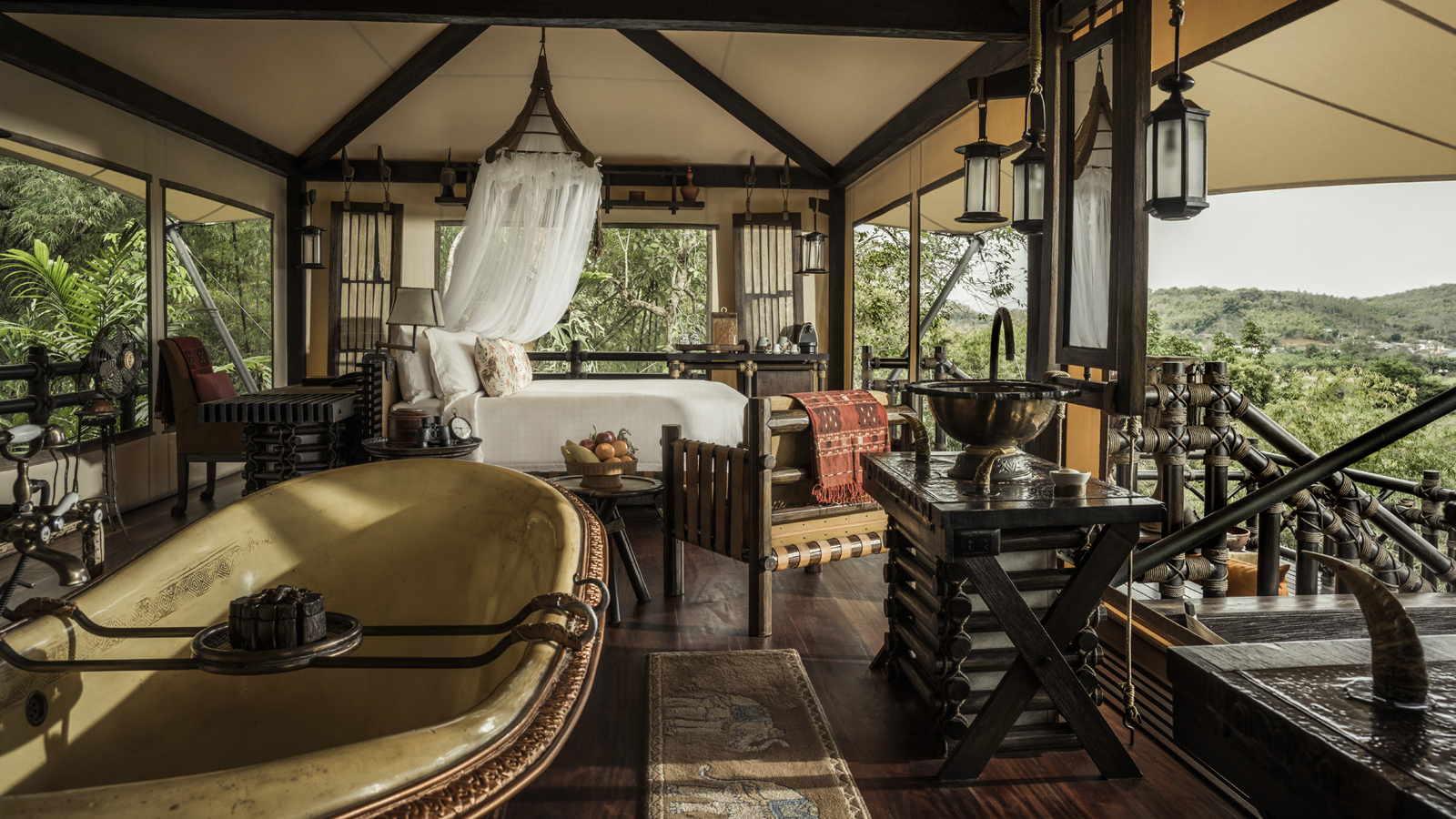 Luxury tent bedroom and copper bath at Four Seasons Tented Camp