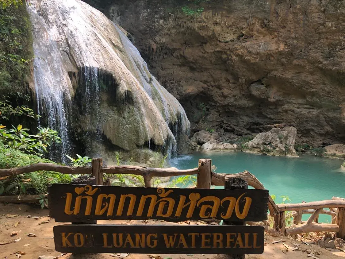 Emerald pool and limestone cascade at Ko Luang Waterfall