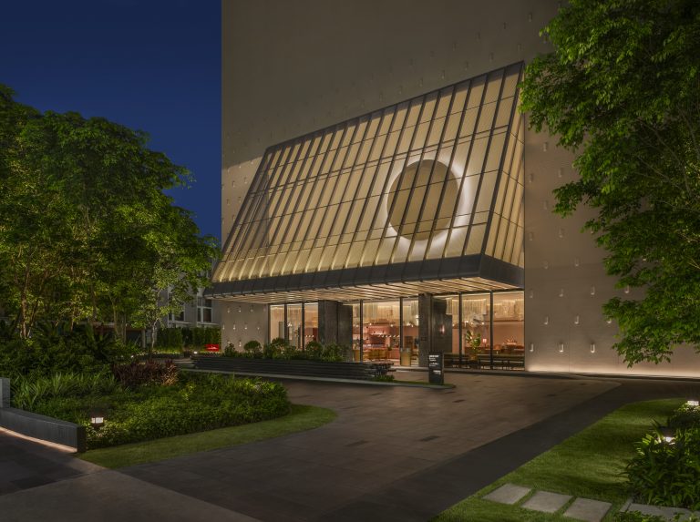KROMO Bangkok Curio Collection facade at twilight