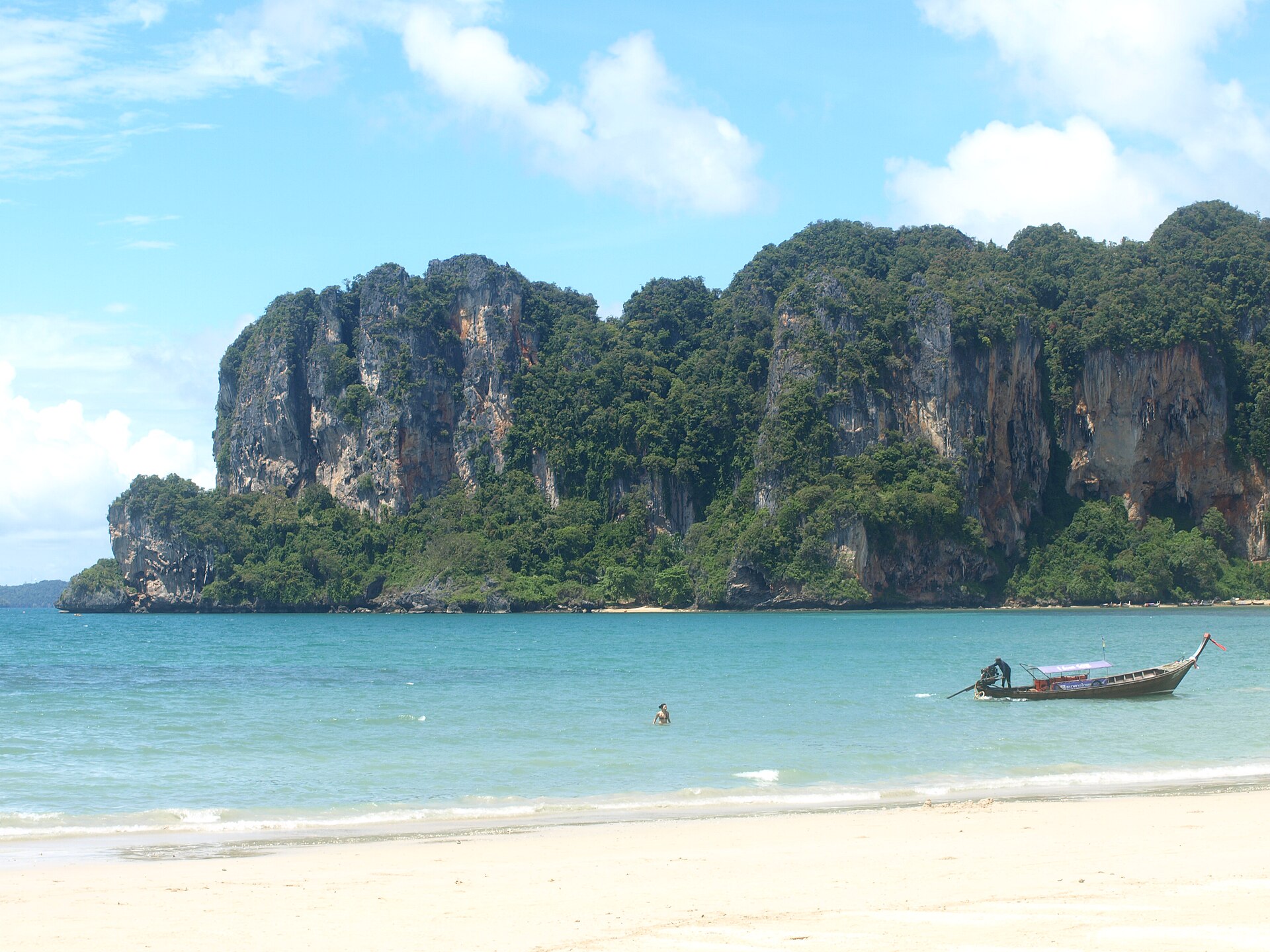 Limestone cliffs rising behind Railay beach