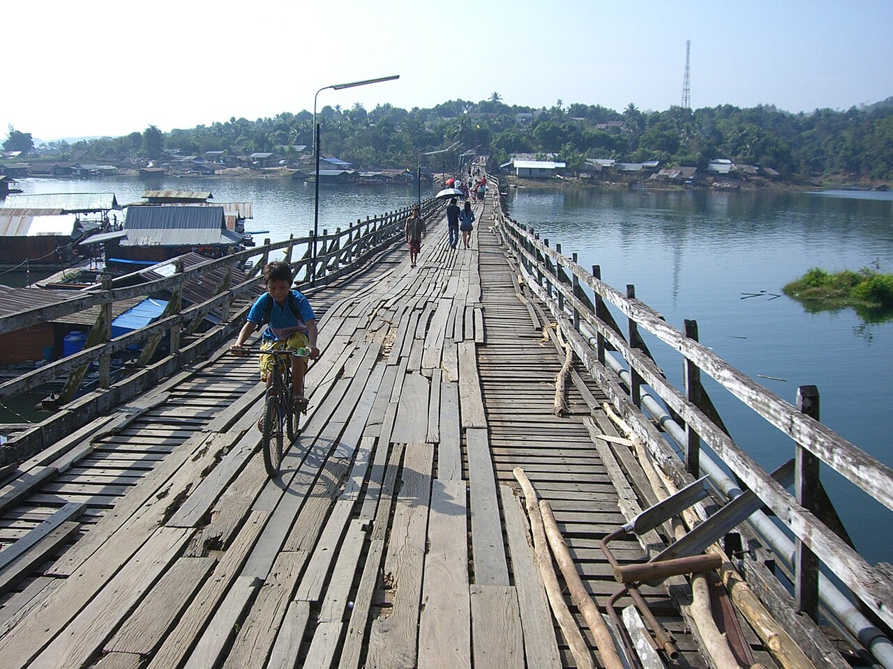 People walking across the Mon Bridge in Sangkhlaburi