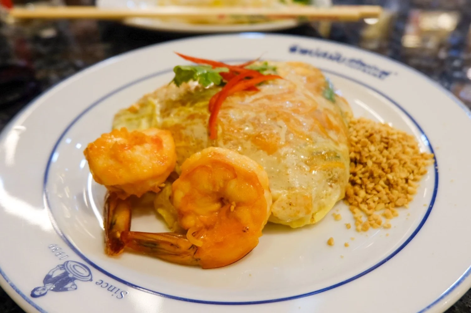 Thipsamai cooks preparing pad thai at Pratu Phi