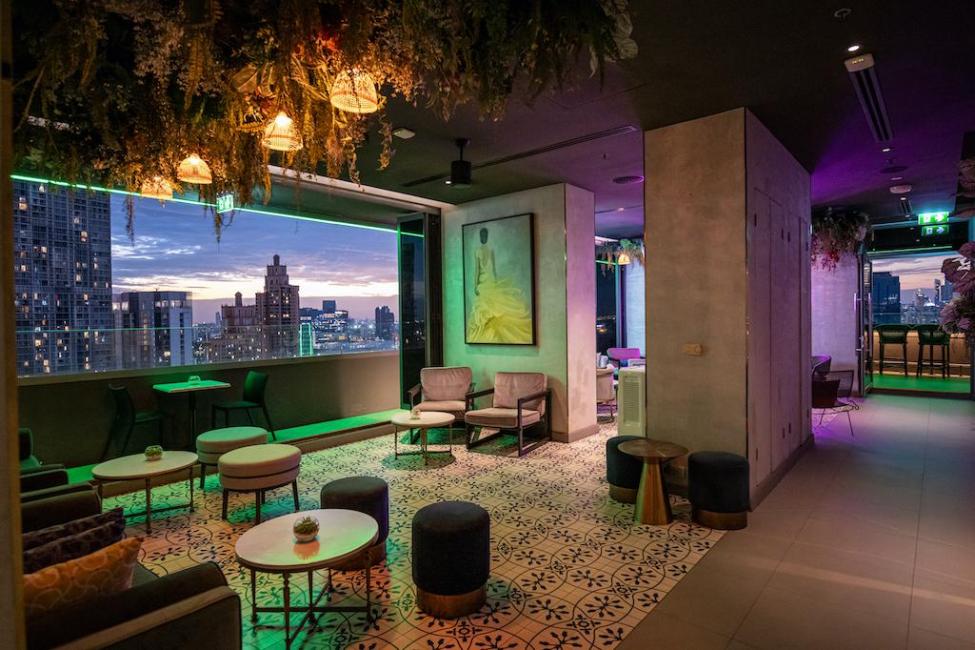 Indoor lounge and skyline view at AIRE BAR Bangkok