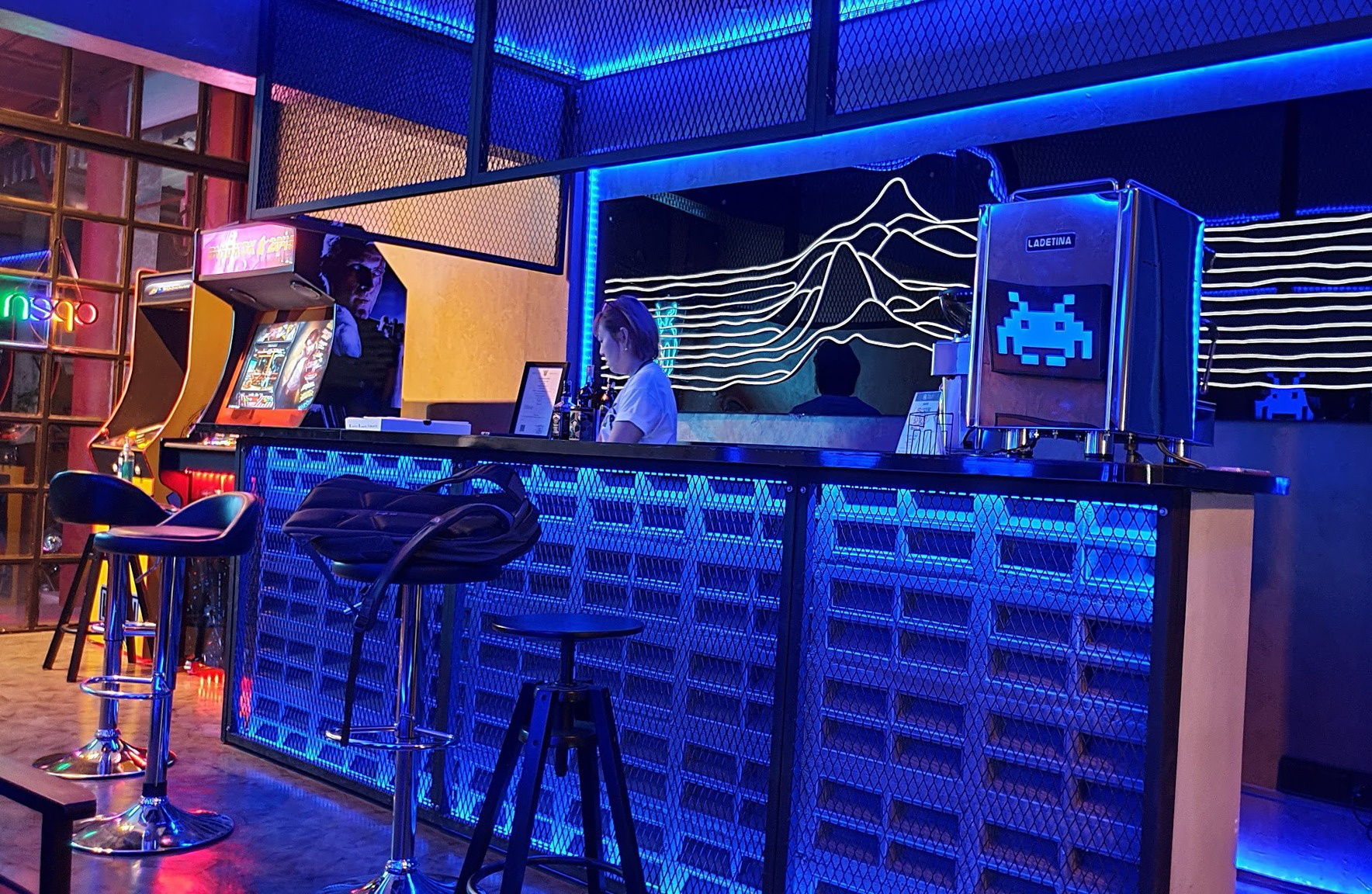 Arcade machines and bar space at Arcadia Bangkok