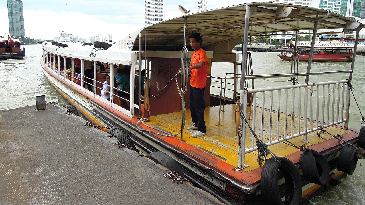 Chao Phraya Express Boat alongside Sathorn Pier in Bangkok