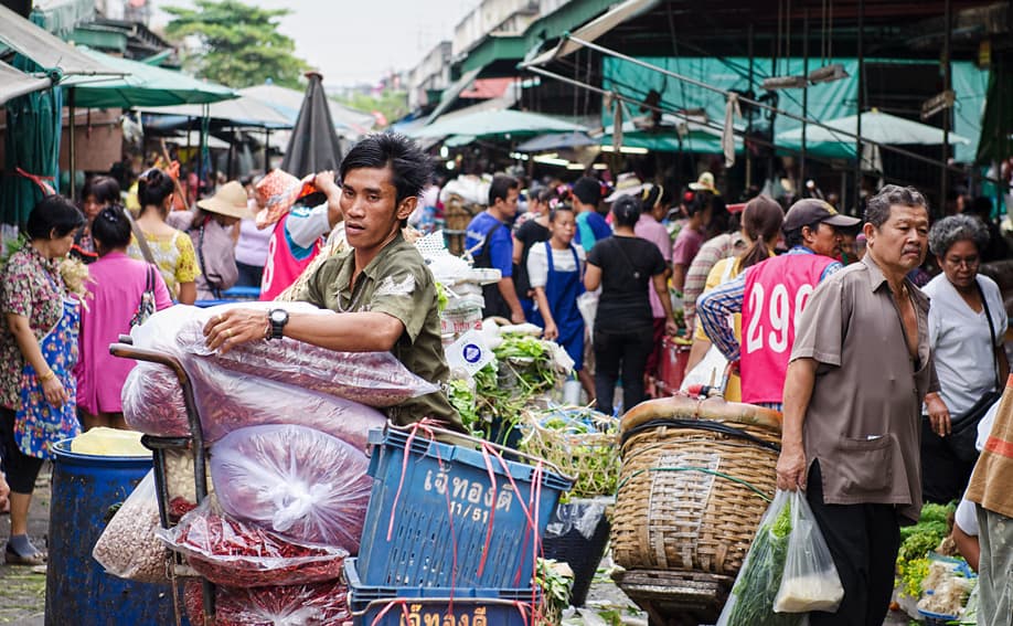 Narrow working aisle inside Khlong Toei Market