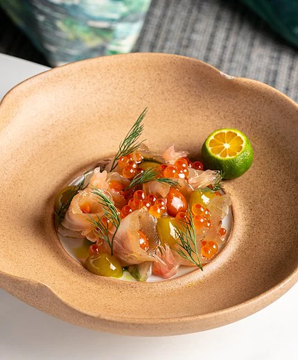 Applewood-smoked kingfish dish at Lily's Bangkok