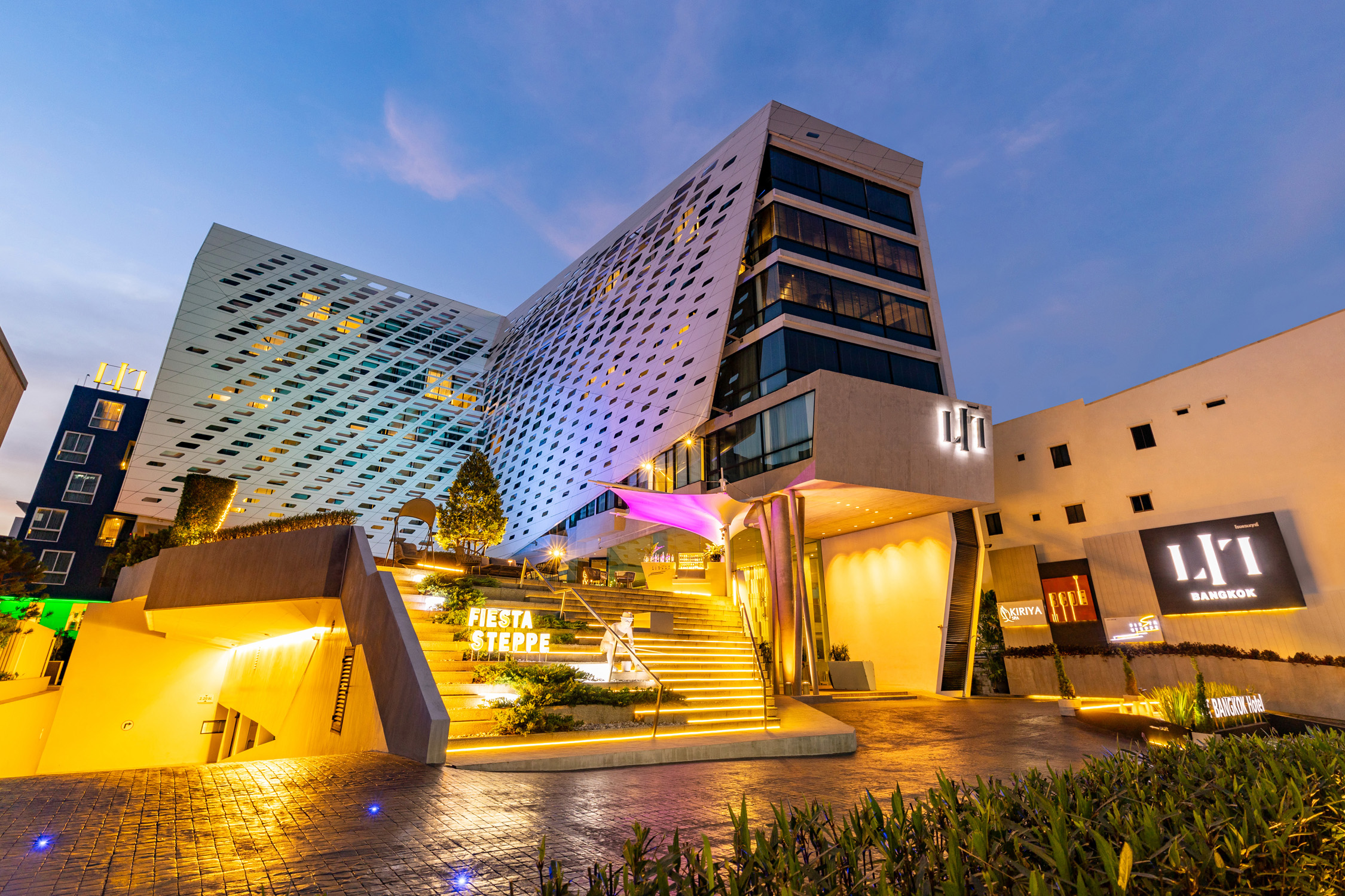 LiT BANGKOK Hotel exterior near Siam at night