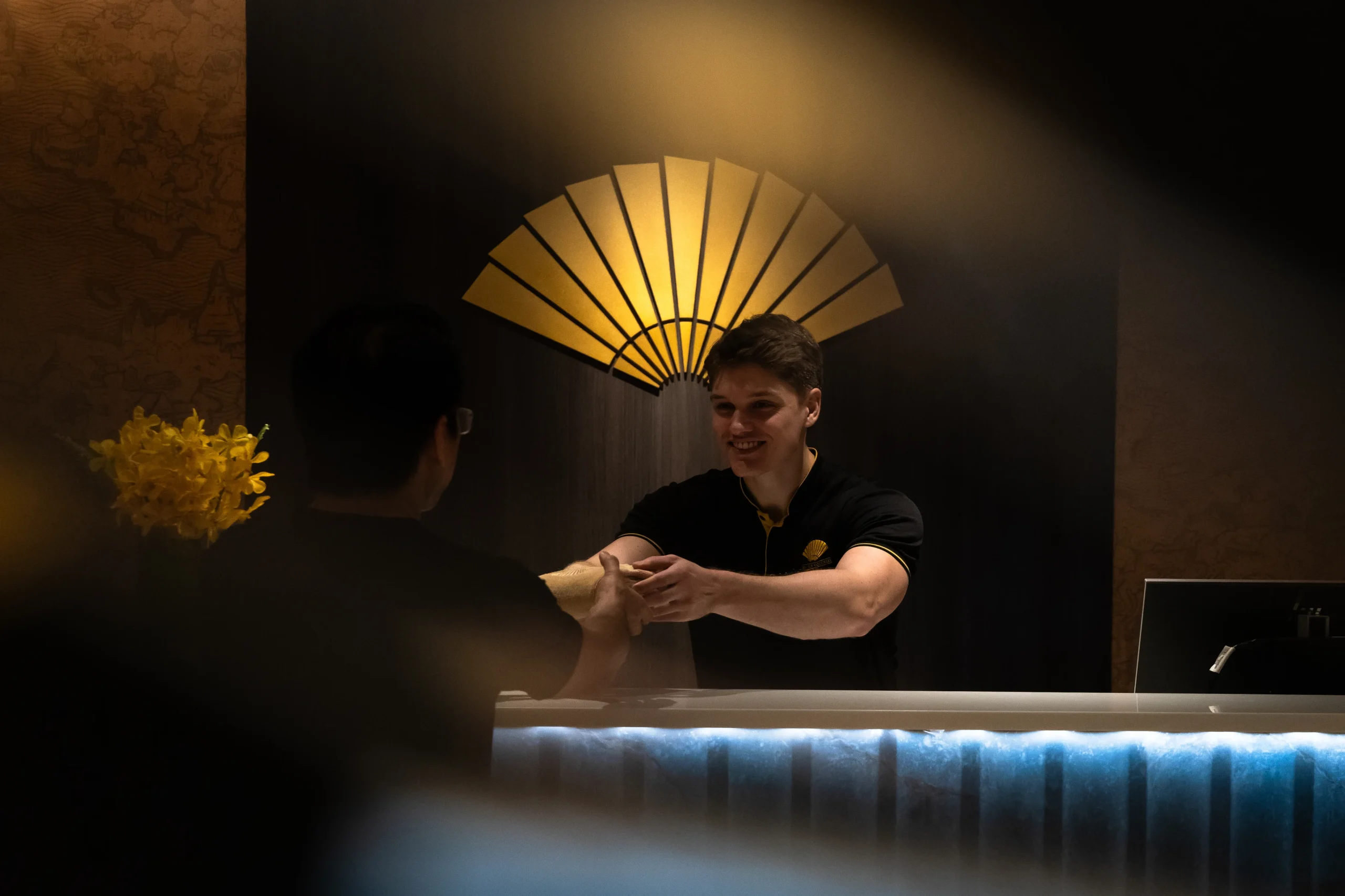 Guest speaking with wellness staff at Mandarin Oriental Bangkok