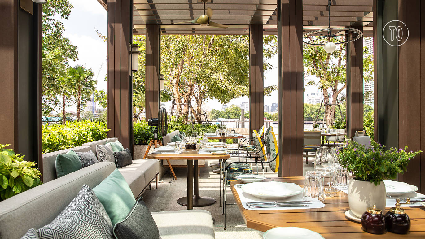 Outdoor tables at Palmier Bangkok by the river