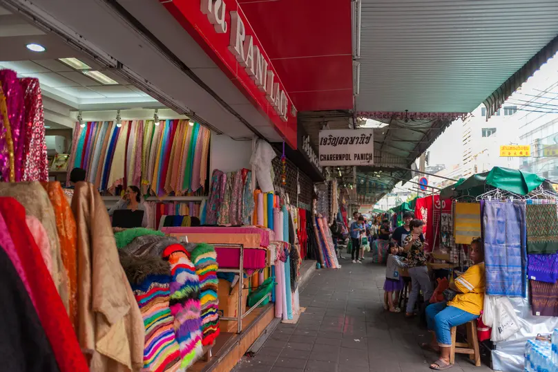 Textiles and goods displayed in Phahurat Market