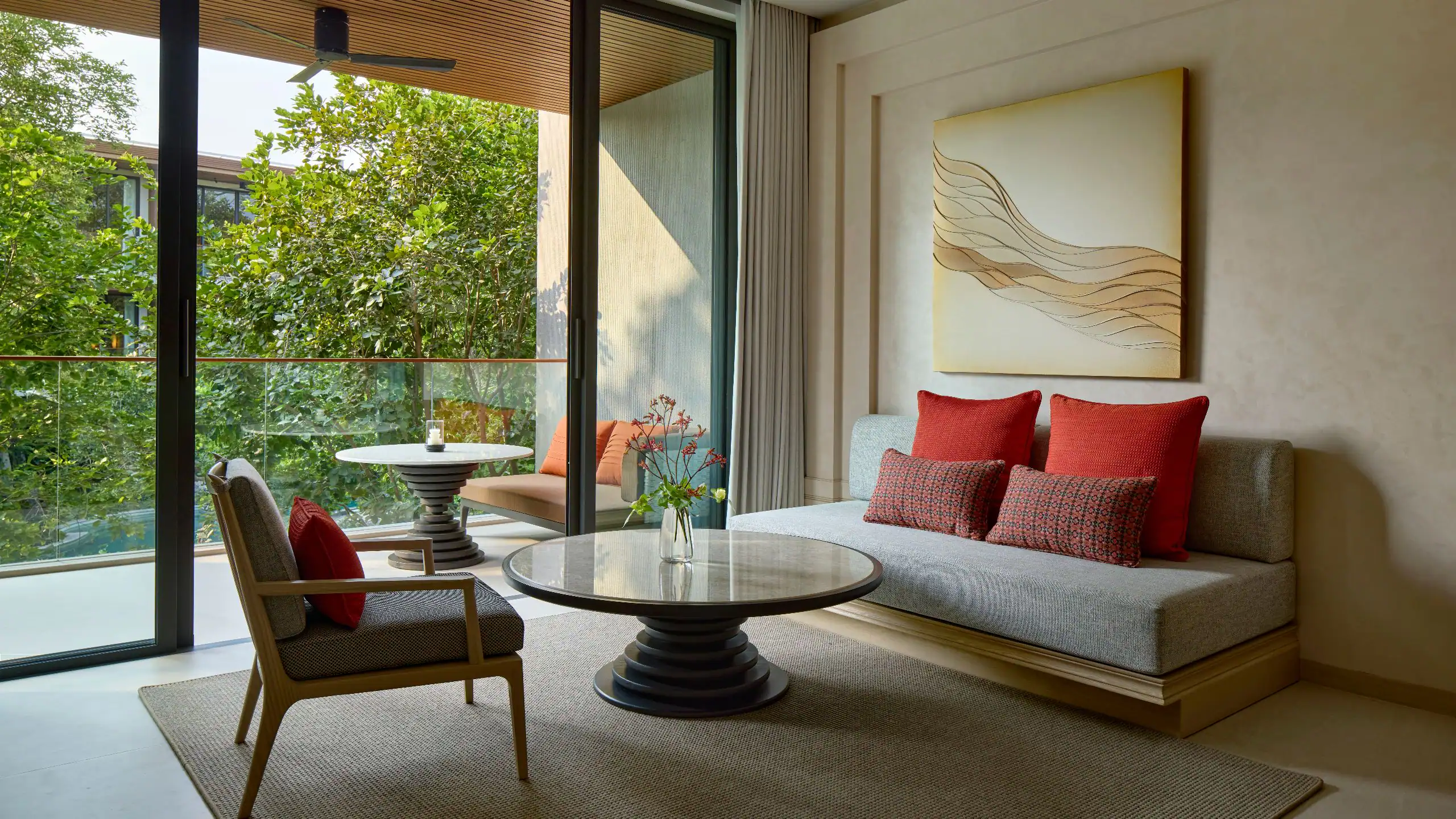 Living room in a forest-view corner suite at The Barai Hua Hin