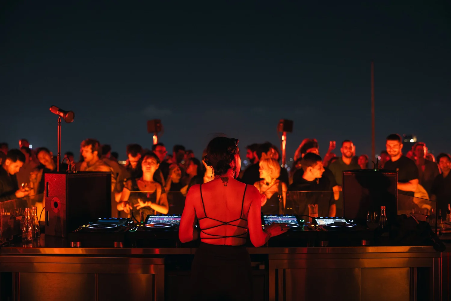 Evening crowd at AETHER rooftop