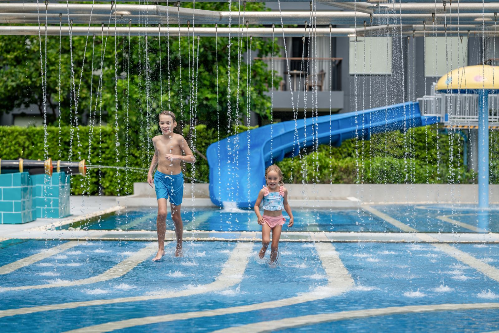 Children playing in the resort pool at Courtyard Phuket Chalong Bay