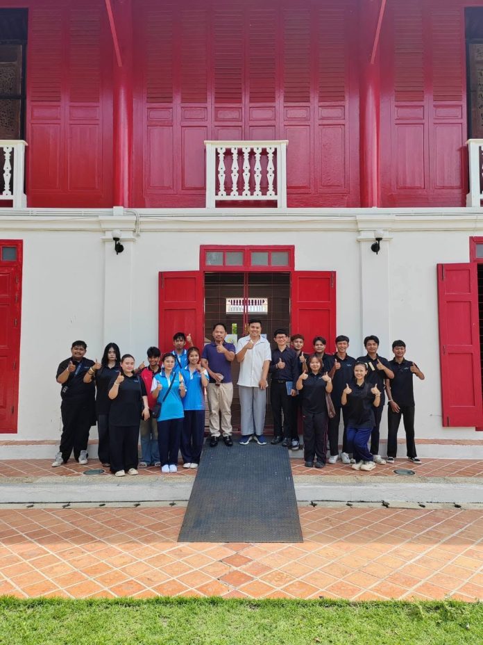 Visitors outside the red heritage building of Songkhla National Museum