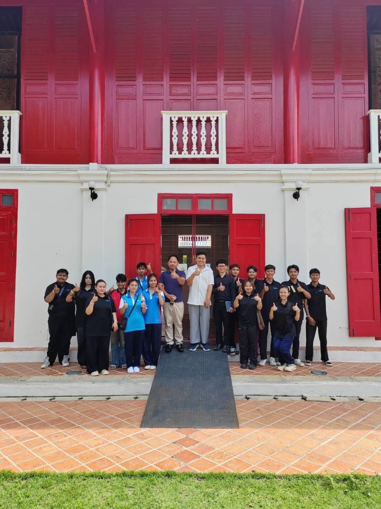 Visitors outside the red heritage building of Songkhla National Museum