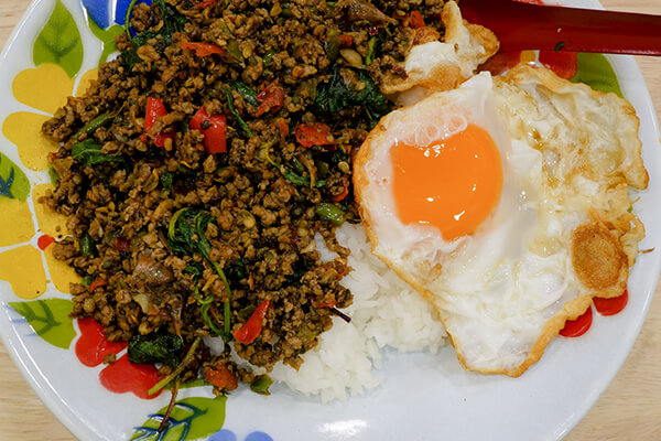 Pork pad kra pao with egg at Phed Mark Bangkok