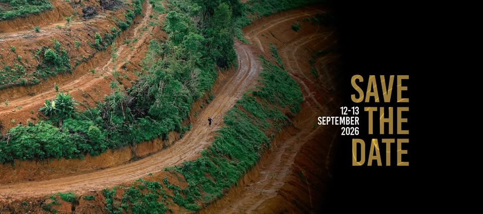 Winding dirt trail through green Phuket terrain