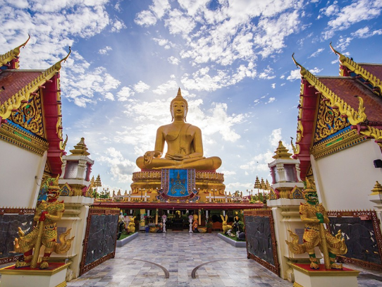 Golden Buddha and temple architecture in Phuket
