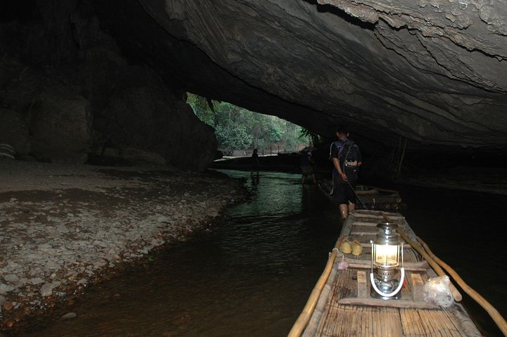 Bamboo raft inside Tham Lod Cave