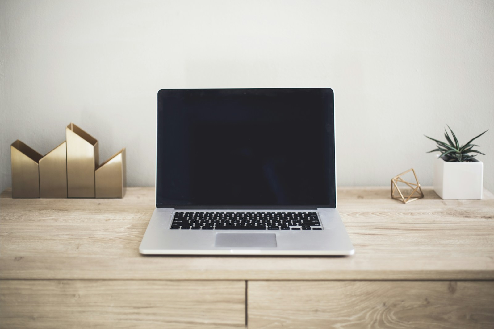 Laptop beside a notebook