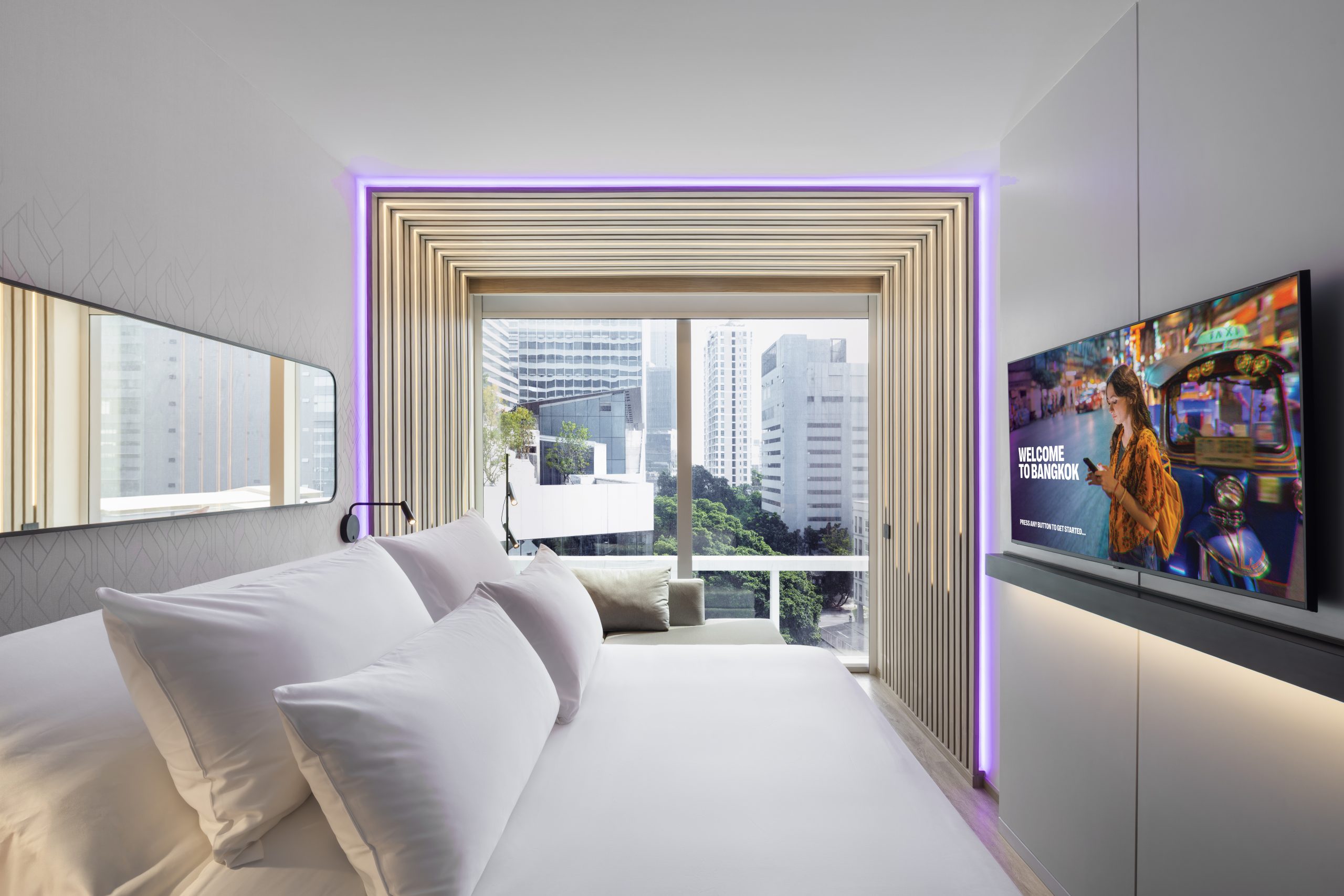 Guest room with city view at YOTEL Bangkok Sukhumvit