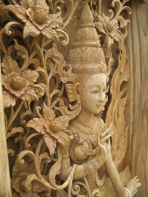 Detailed carved wooden panel at Baan Tawai