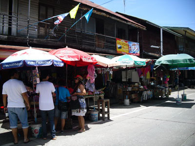 Wooden shophouses and stalls in Ang Sila Old Market