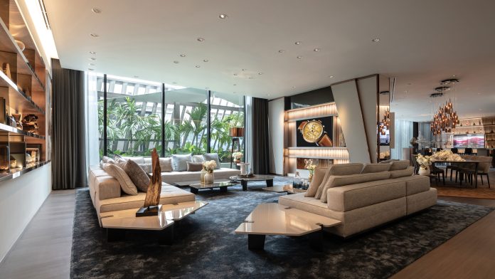 Apartment-style lounge and watch display at AP House Bangkok