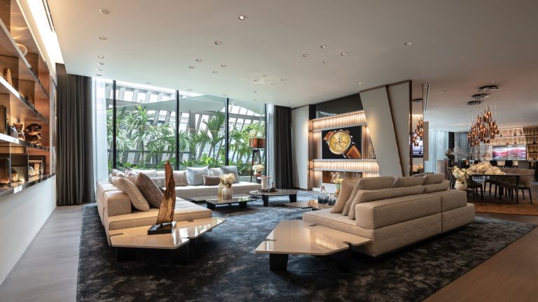 Apartment-style lounge and watch display at AP House Bangkok