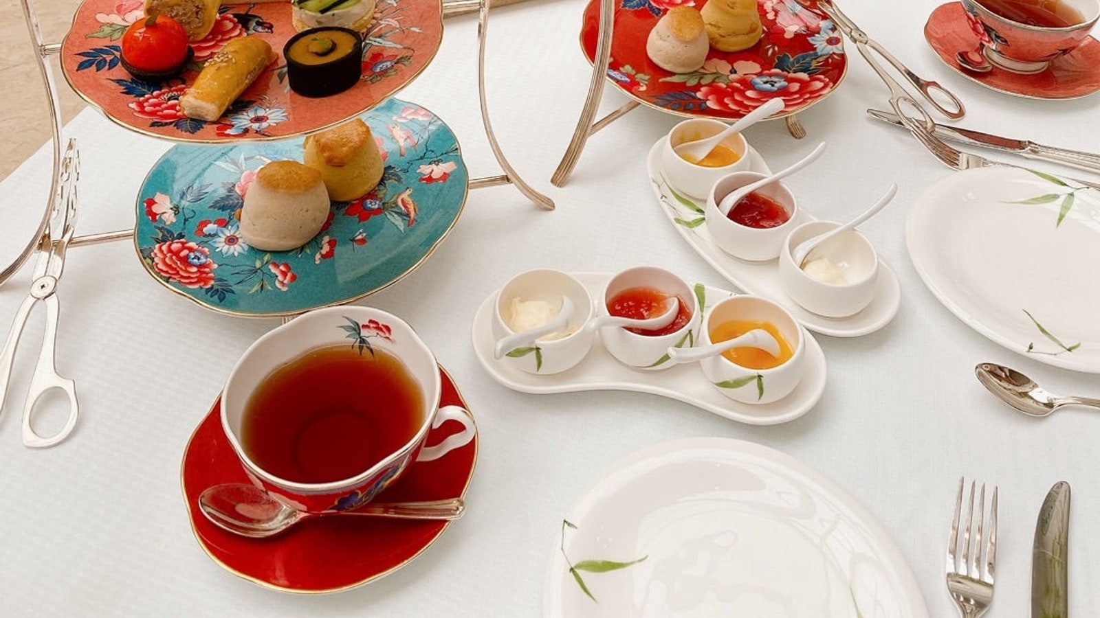 Tiered afternoon tea stand and patterned china at The Authors Lounge Bangkok