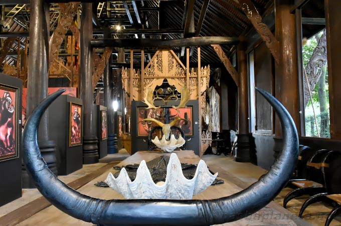 Horn and shell installation inside a Baan Dam pavilion