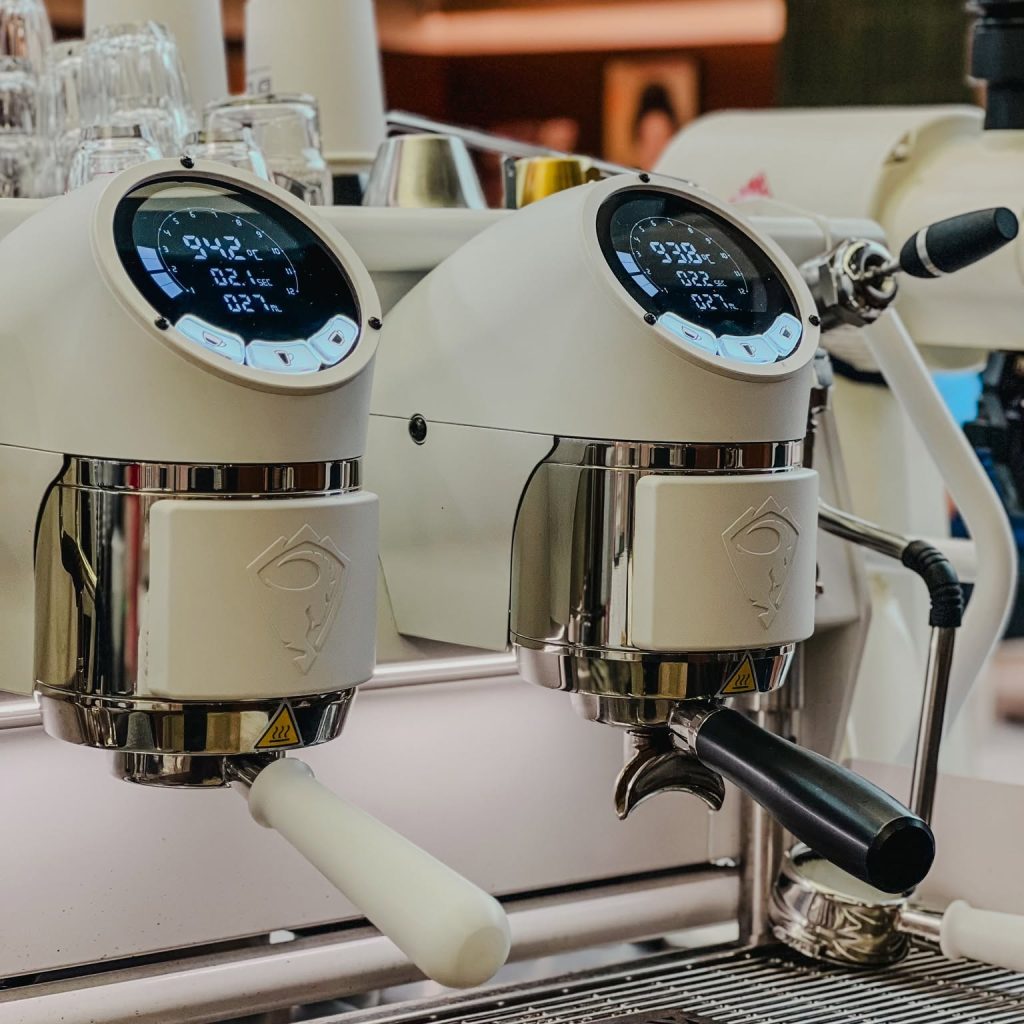 White espresso machines at Beva Coffee Roaster
