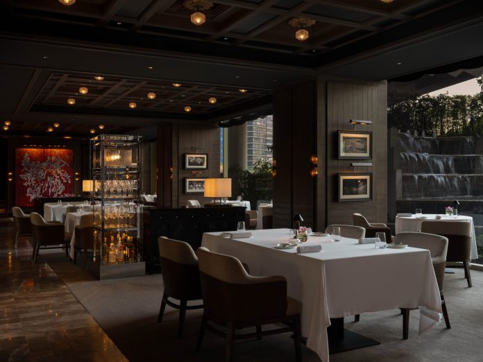 Cannubi by Umberto Bombana dining room overlooking the Dusit Thani waterfall