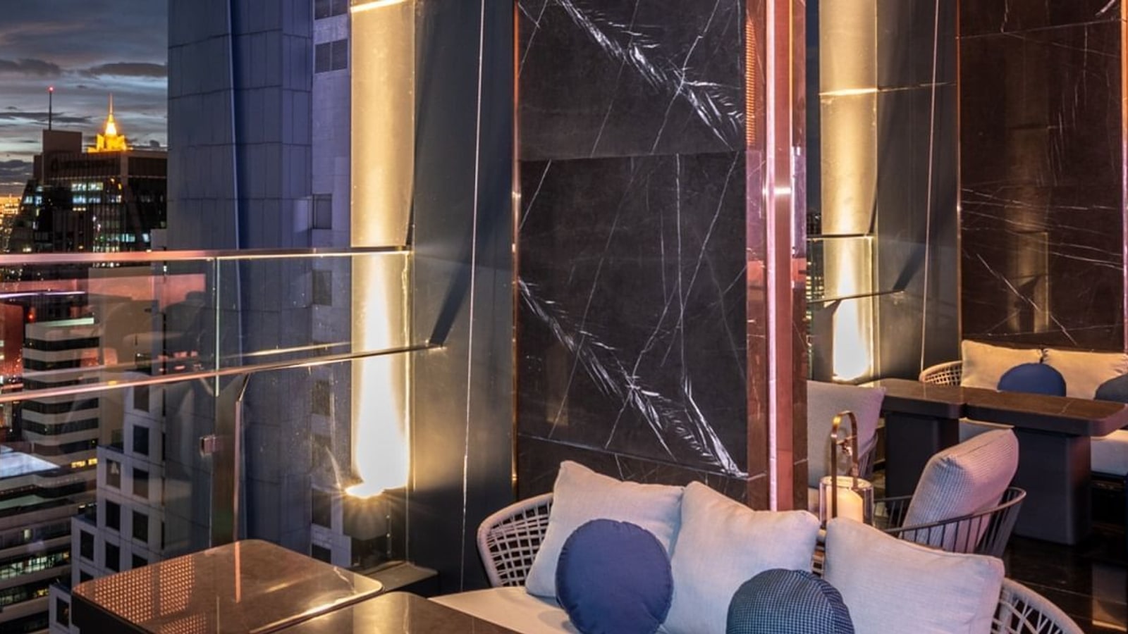 Tables and illuminated bar seating at Cooling Tower Bangkok