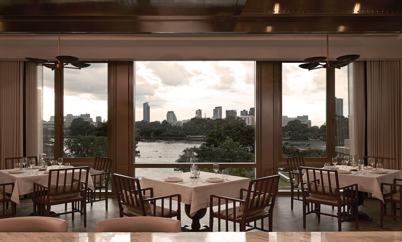 Riverside tables inside Côte by Mauro Colagreco