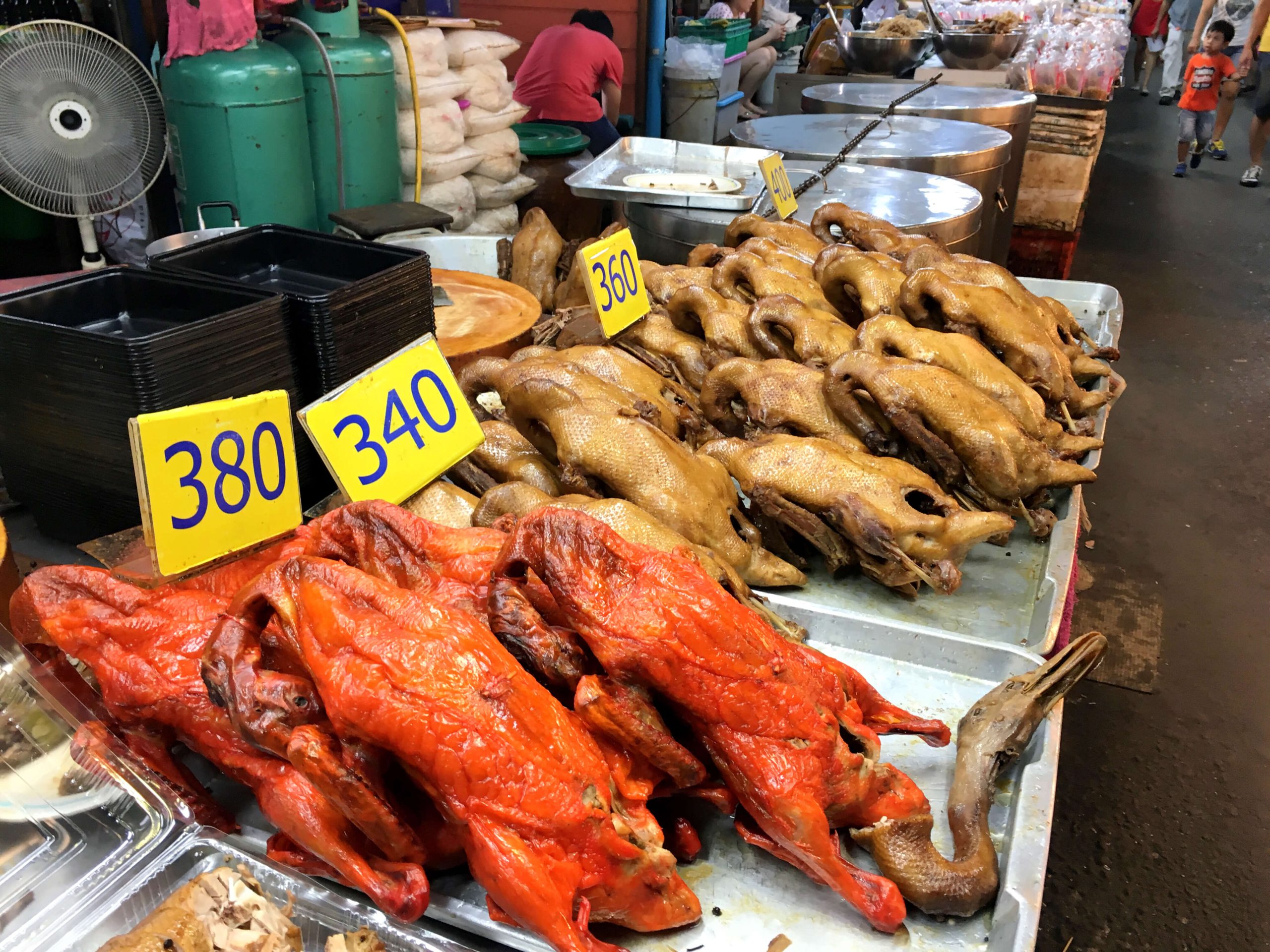 Prepared duck and market food at Don Wai riverside market