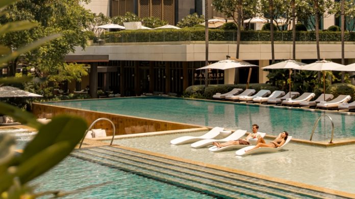 Four Seasons Bangkok pool Guests beside the pool at Four Seasons Hotel Bangkok