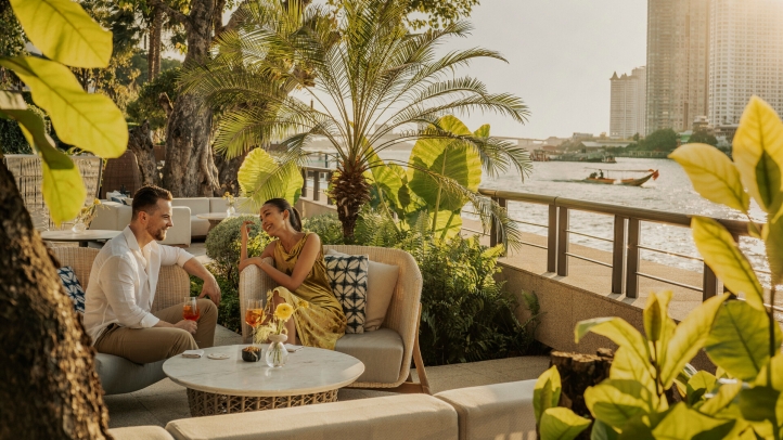Guests seated beside the Chao Phraya River