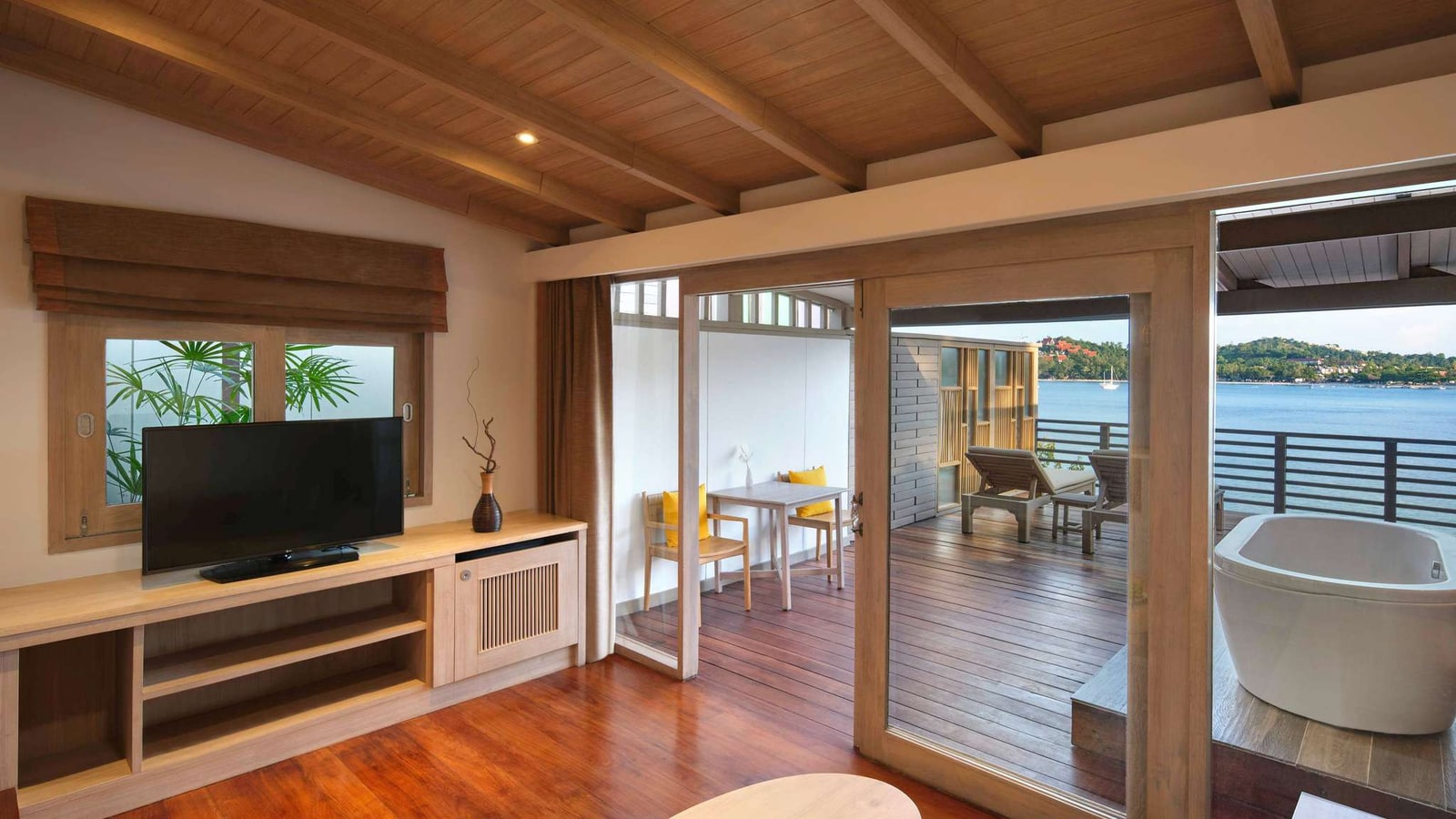 Spacious wood-toned suite with sea view at Garrya Tongsai Bay Samui
