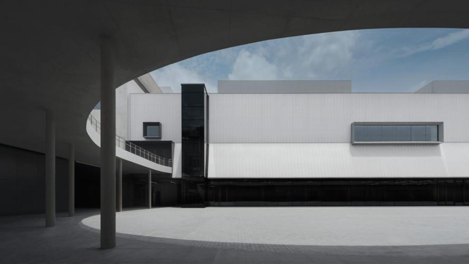 White museum courtyard and curved architecture at Dib Bangkok
