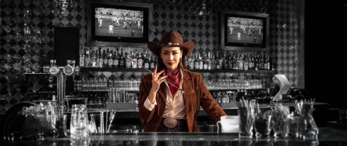 Howdy 25 bar takeover Gift Visansaya behind the bar for Howdy, 25!