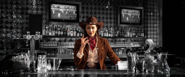 Gift Visansaya behind the bar for Howdy, 25!