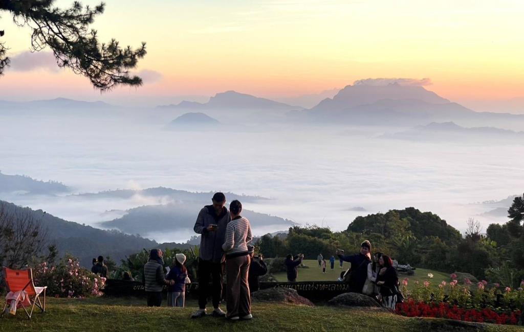 Visitors viewing a sea of mist at Huai Nam Dang National Park